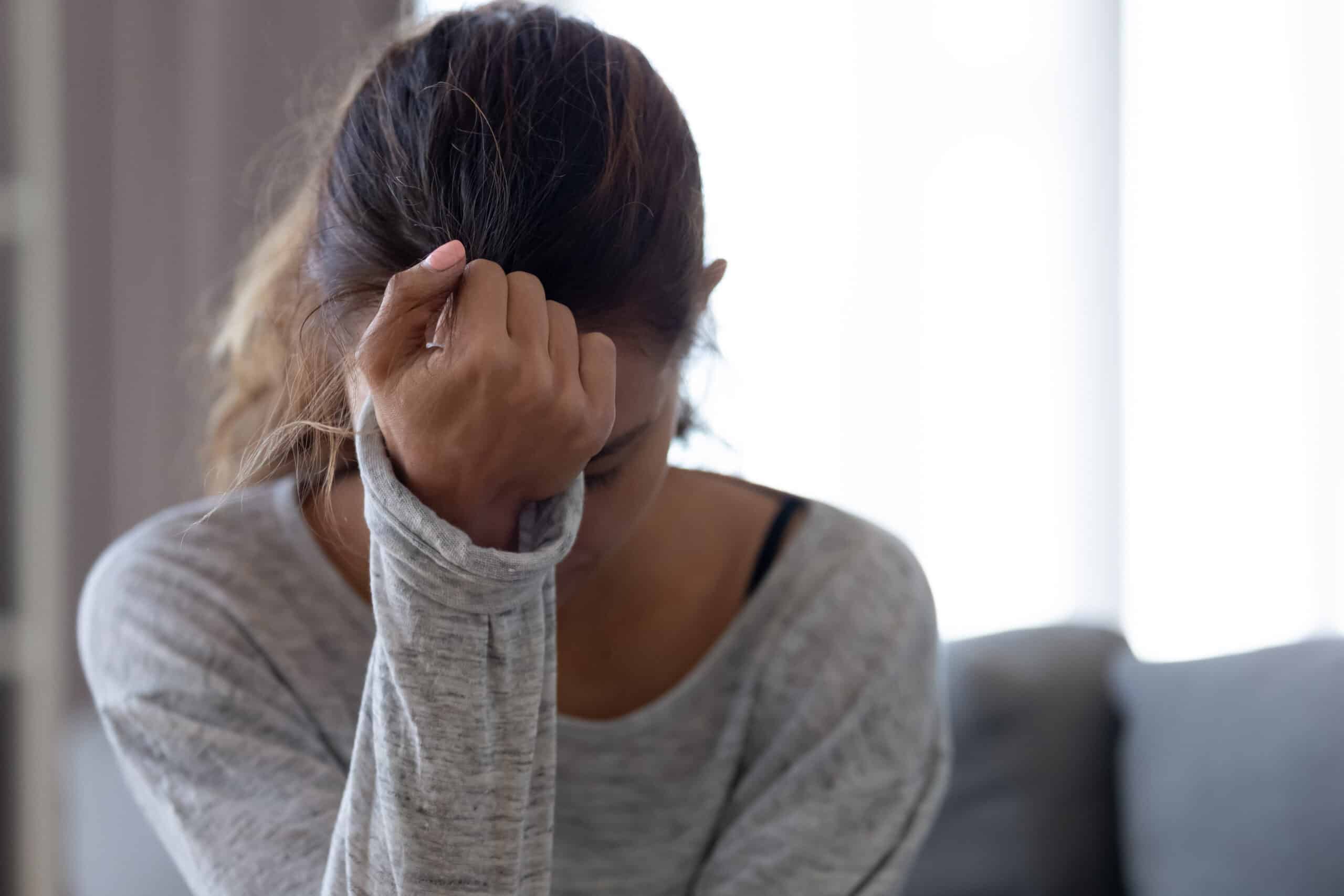 Women with hand on her head